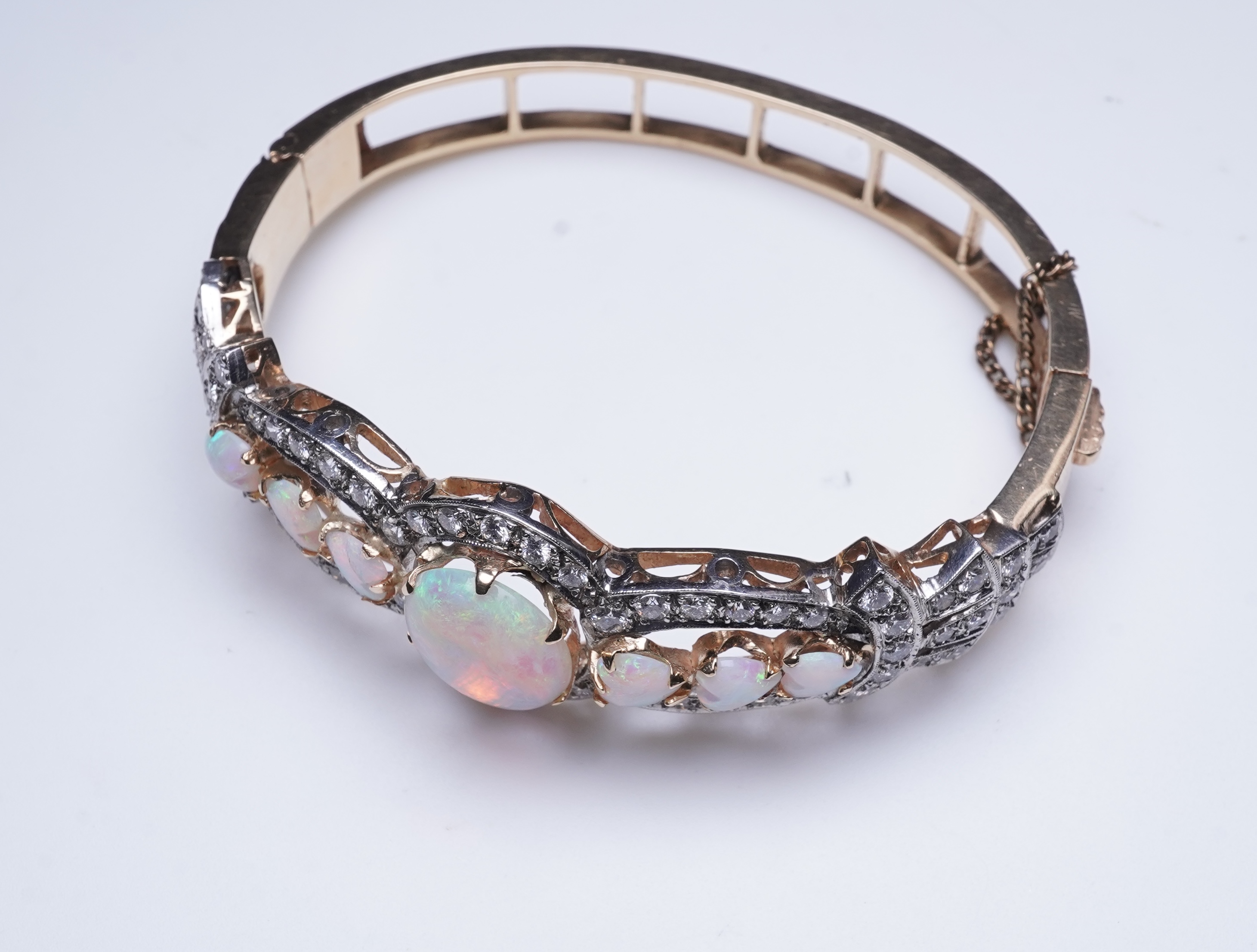 An opal and diamond bangle